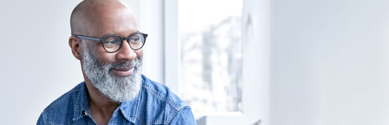 Happy Man Staring Out of Window