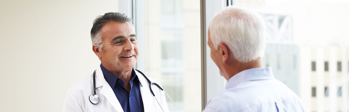 Doctor Having Conversation with Male Patient