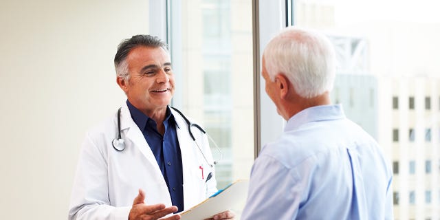 Doctor Having Conversation with Male Patient