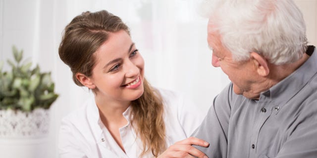 Nurse Chatting to Male Patient